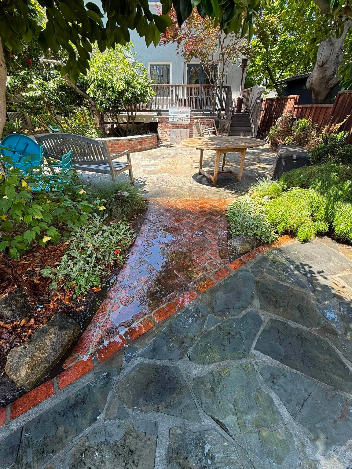 Clean flagstone and brick patio after pressure washing
