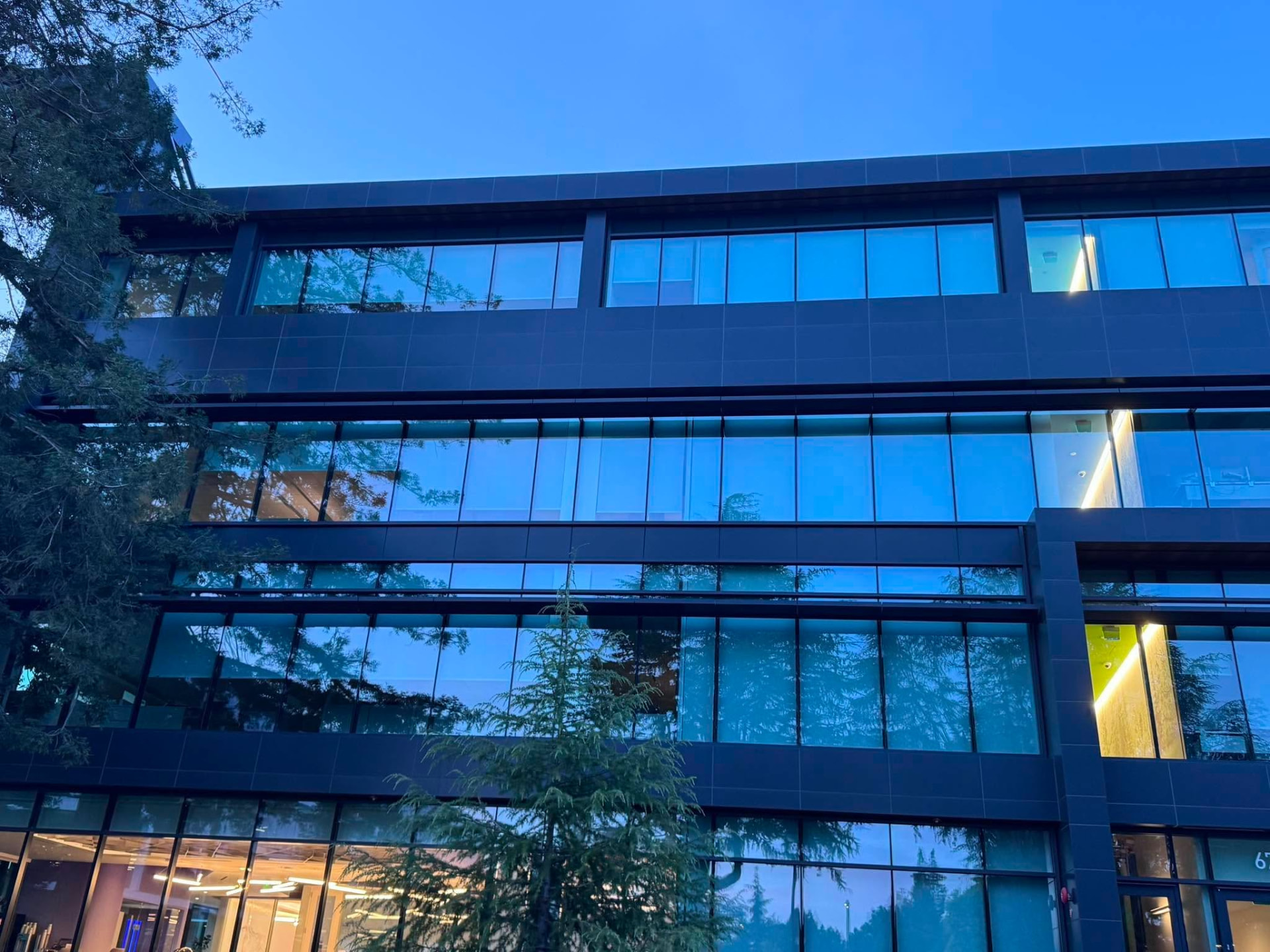 Freshly cleaned glass facade of a commercial office building